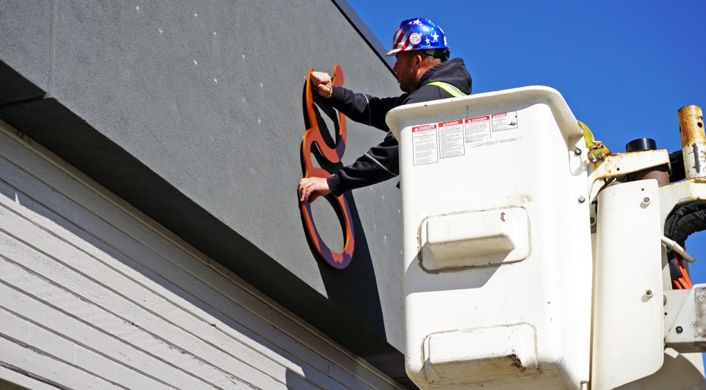 The Good Chemistry signage goes up in Aurora. Photo by George Demopoulos.