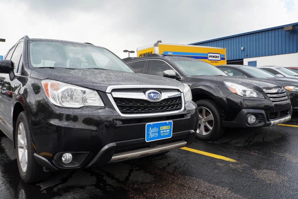 Subarus for sale sit in the Automotive Avenues lot on West Sixth Avenue. Photos by Katherine Blunt.