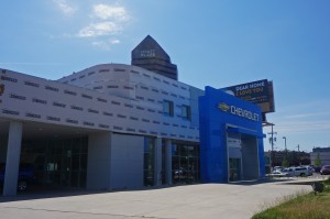 The Chevy dealership, which was shut down, will be razed and replaced with a new BMW dealership. Photo by Burl Rolett.