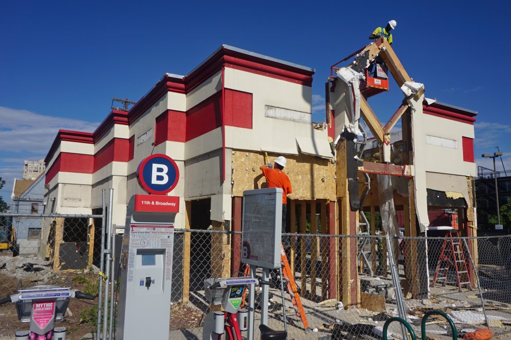 Crews tore down a former Arby's restaurant at 11th and Broadway. Photo by Burl Rolett.