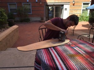 Tommy works on a deck cutout. Photo courtesy of Lowtide.