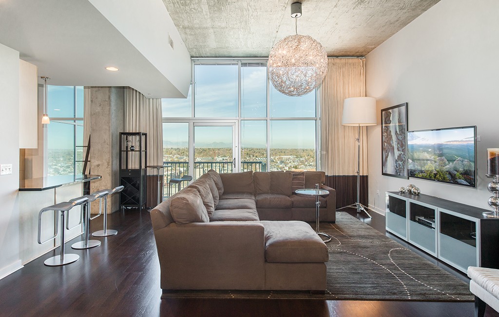 The apartment is part of the Glass House complex, named for its floor-to-ceiling windows overlooking LoHi, the Rockies and the South Platte. (Courtesy LIV Sotheby's)