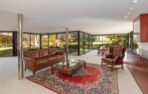 A wall of windows overlooks apple trees in the backyard. (Courtesy LIV Sotheby's)