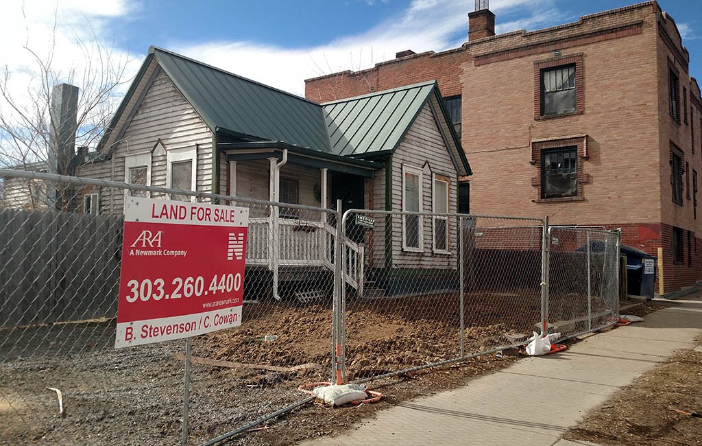 The property includes a small cluster of single-family homes surrounding a red brick apartment building just south of Viking Park. (Burl Rolett)