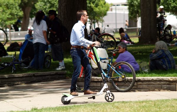 man on scooter