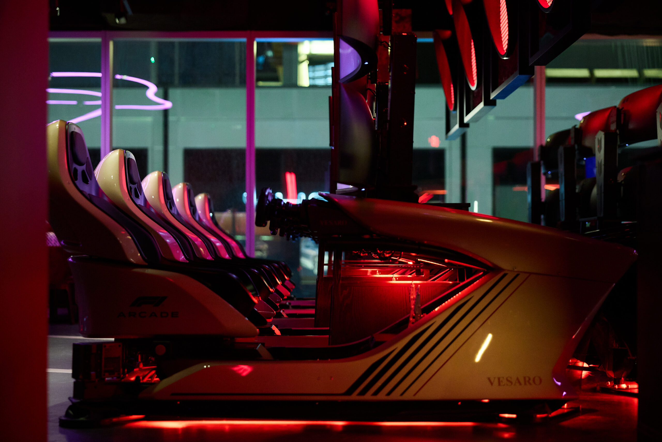 Formula One race simulator bar driving into RiNo 1 F1 Arcade Boston by Ian Wallman 04553 scaled