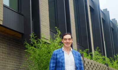 Justin Borus stands in front of 101 S. Madison St.