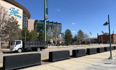 Pretred barriers outside Ball Arena
