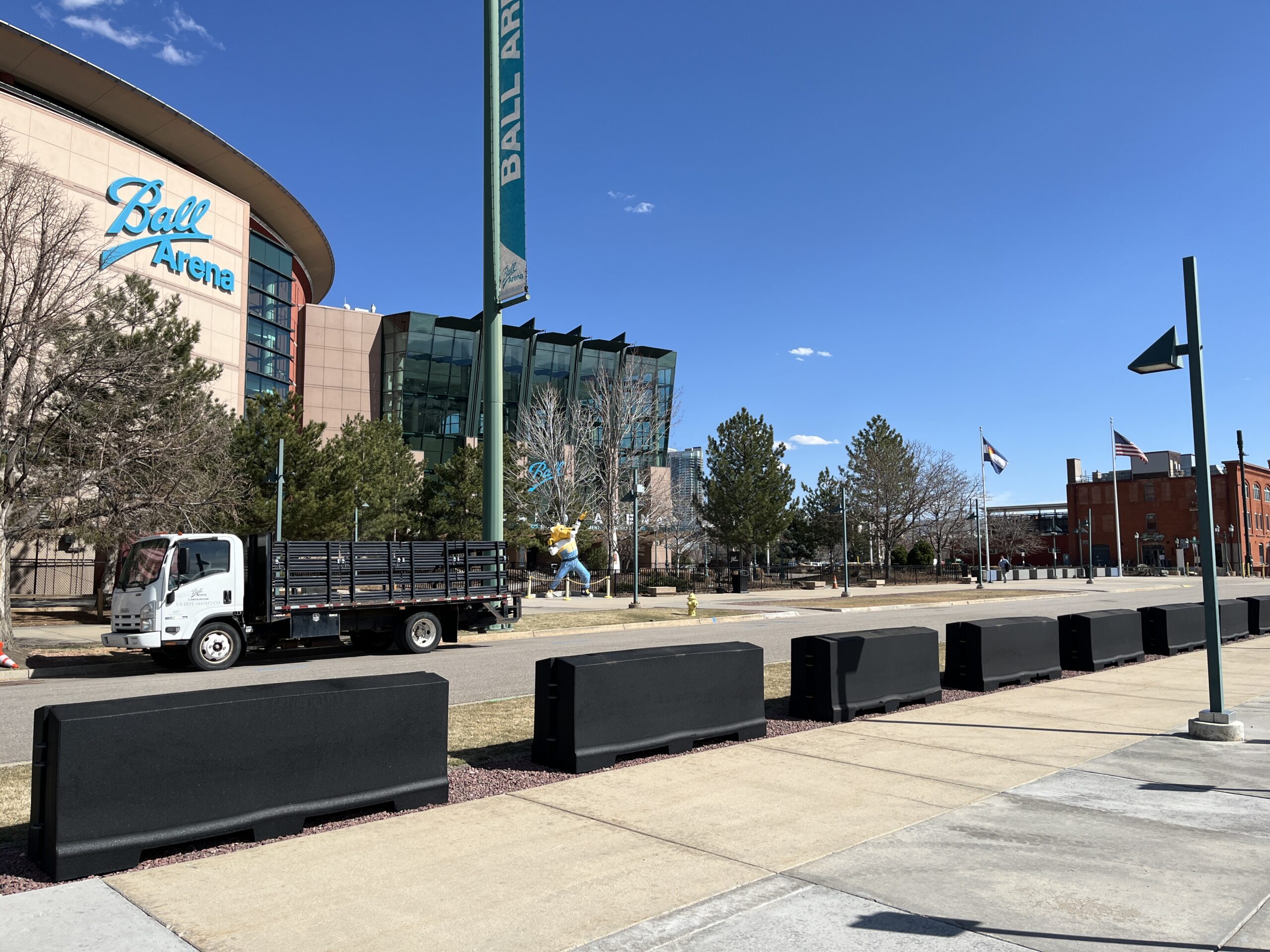 Pretred barriers outside Ball Arena