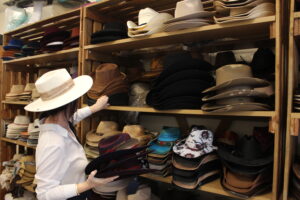 Maui wildfire victim, newly widowed, struggles to keep 16th Street Mall shop going 6 aloha violeta w aloha hats